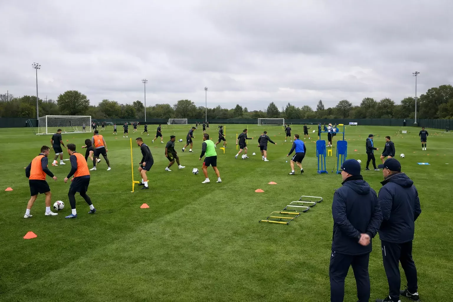 Football squad during a training session on the practice pitch